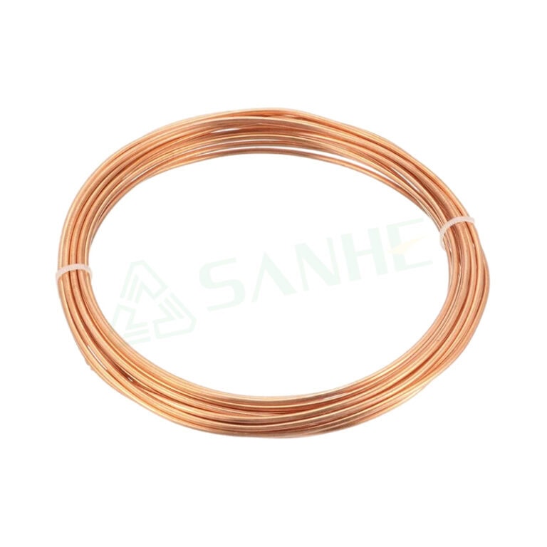 Close-up of a copper capillary tube coil used in HVAC systems for precise refrigerant flow control.